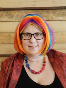 An image of Yen Purkis in a colourful wig