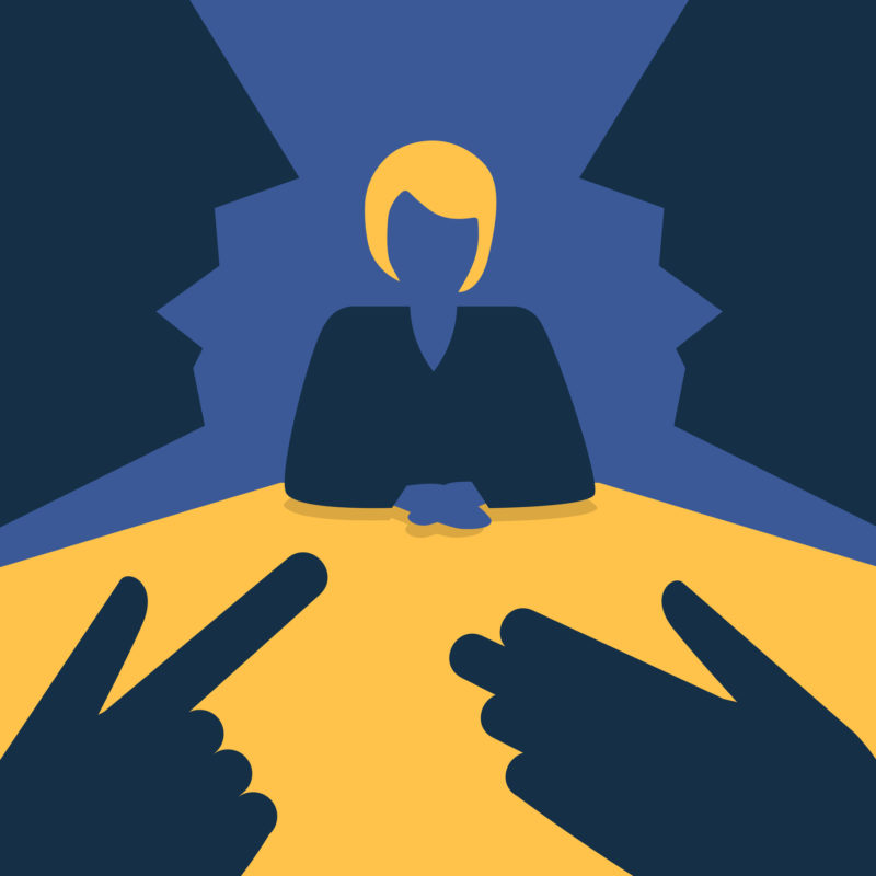 Illustration of the figure of a woman sitting in a job interview in the background. In the foreground we see the sillhouette of two faces talking and gesturing to each other.